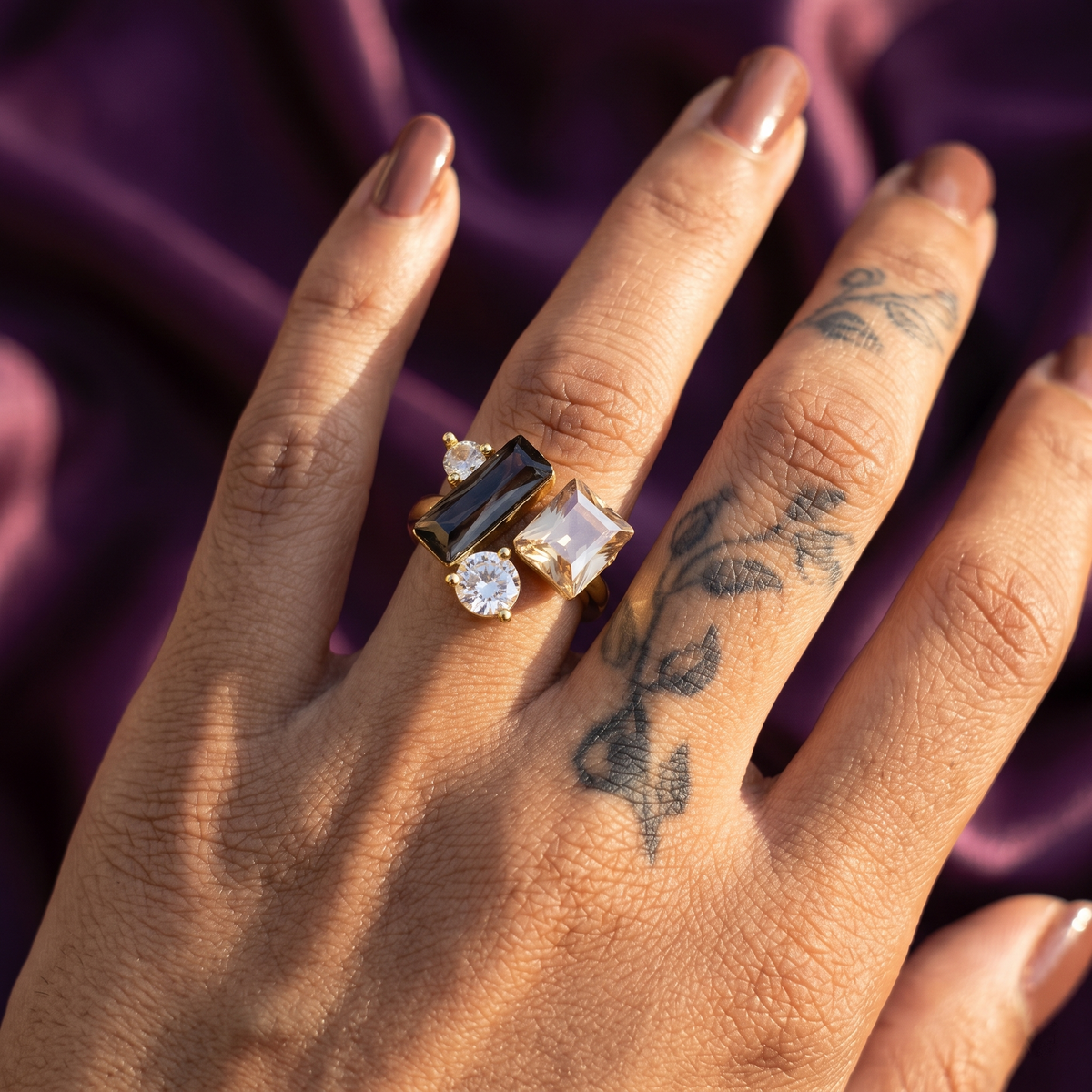 Hand wearing gold four-stone crystal cluster open ring – bold statement cocktail ring, perfect gift for her