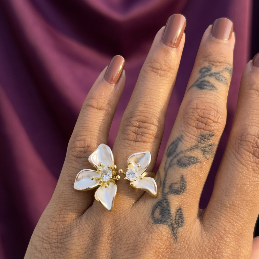 Hand wearing gold twin lily flower open ring with crystals – adjustable floral party wear statement ring, perfect gift for her