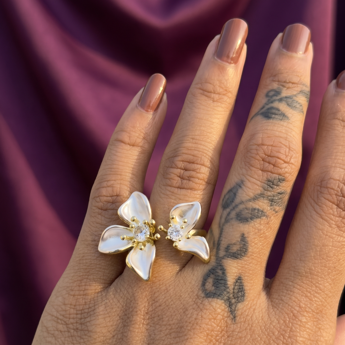 Hand wearing gold twin lily flower open ring with crystals – adjustable floral party wear statement ring, perfect gift for her