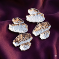 Pair of silver hammered pebble cascade drop earrings on plum satin – anti-tarnish stainless steel sculptural statement earrings by Style With Anjaly