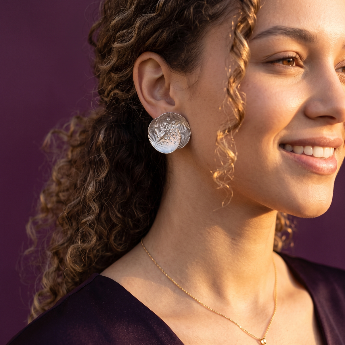 Side view of silver crystal sunburst stud earring on ear – stainless steel floral statement earrings, perfect gift for her